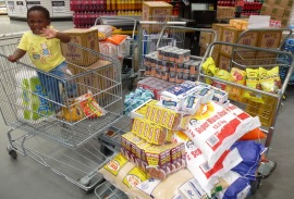 Shopping for 50 gogos fills four trolley wagons and two shopping carts